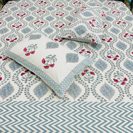 Floral and geometric patterned bedsheet with pillows in Blue, pink and white
