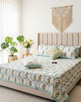 Bougainvillea yellow floral pure cotton bedsheet – styled on a bed