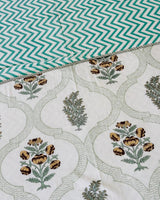 Green medallion trellis reversible mulmul cotton dohar with mustard-brown floral bootis and teal chevron reverse
