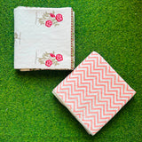 Pink-red floral spray reversible mulmul cotton dohar with a peach chevron reverse
