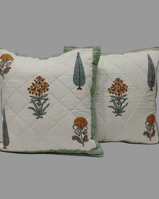 Pair of Gulmohar green quilted cushion covers with floral and tree motifs
