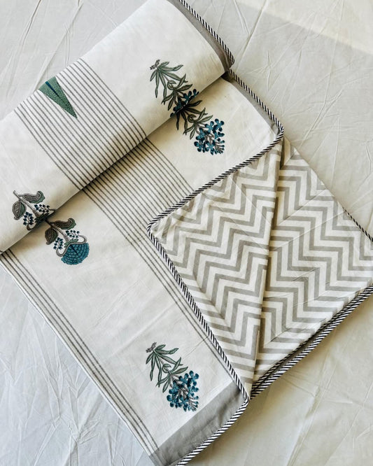 Sage green striped reversible mulmul cotton dohar with a marigold and blue bloom motif
