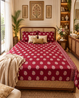 Mehfil Red bedsheet and pillow covers on a cane bed