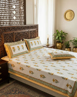 Mridula yellow floral pure cotton bedsheet – styled on a bed