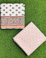 Orange floral cluster reversible mulmul cotton dohar with grey-green accents and an orange chevron reverse