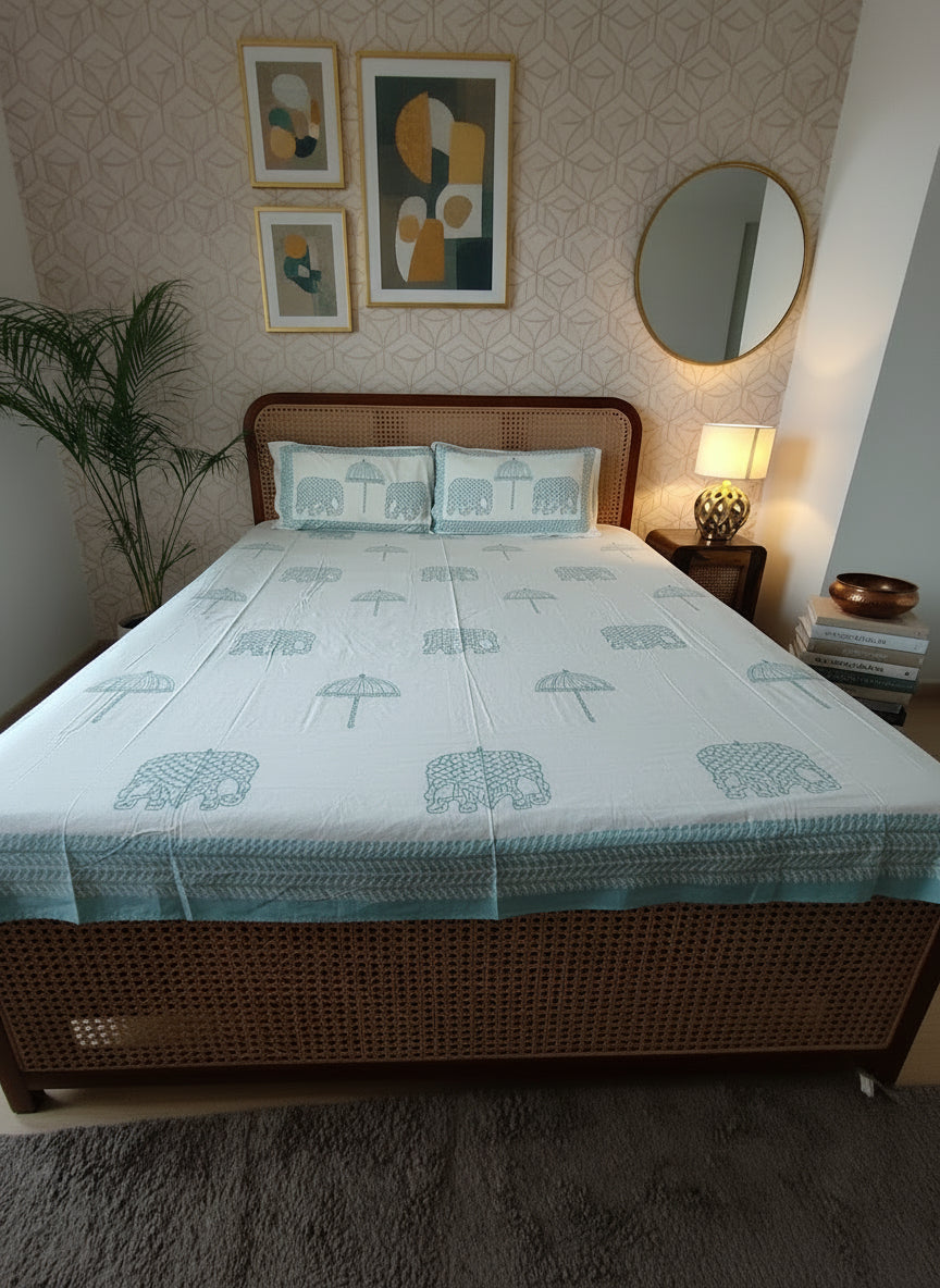 Bedding set with size chart on a bed