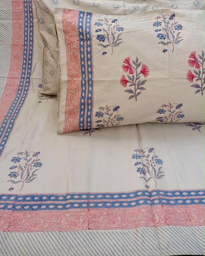 Aparajita hand block Percale Cotton bedsheet with pink and blue floral buta on ivory and a striped border, with pillow covers