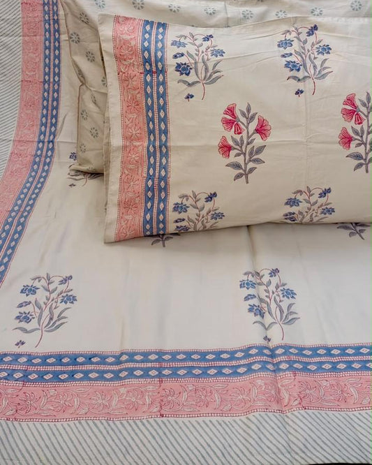 Aparajita hand block Percale Cotton bedsheet with pink and blue floral buta on ivory and a striped border, with pillow covers