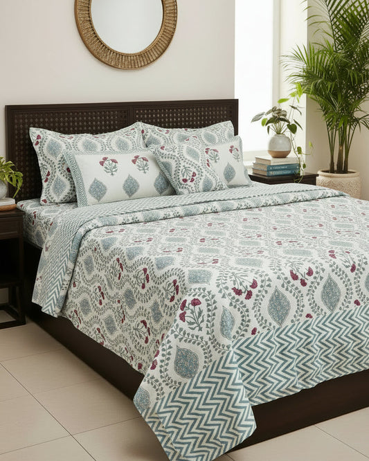 Floral and geometric patterned bedsheet with pillows in Blue, pink and white