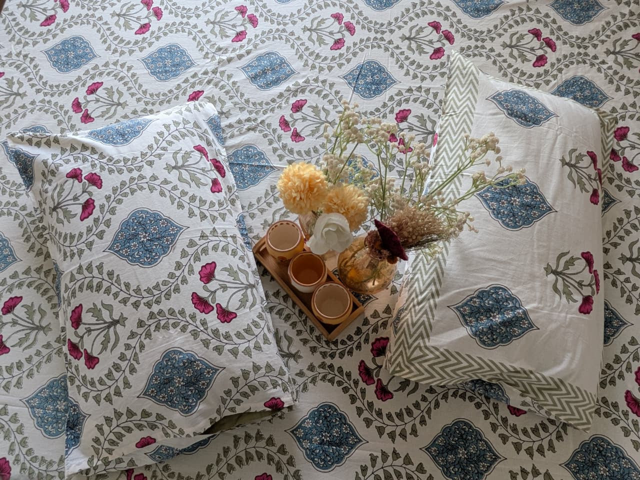 Floral patterned bedding with pillows