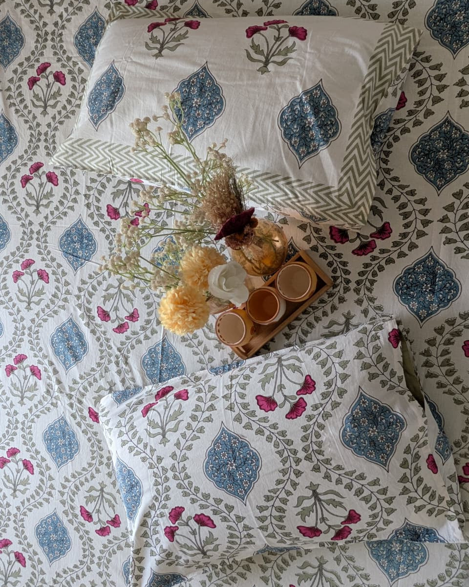 Floral patterned bedding with pillows