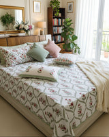 Bougainvillea red floral pure cotton bedsheet – styled on a bed