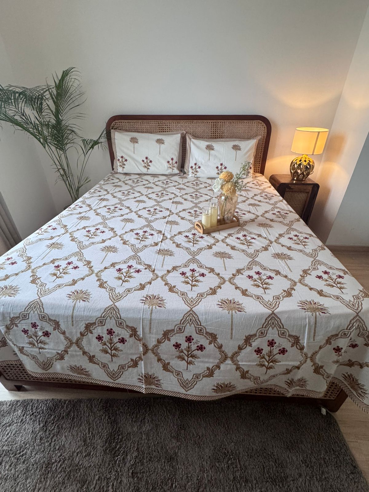 Bedsheet with floral-patterned bedding in a bedroom setting