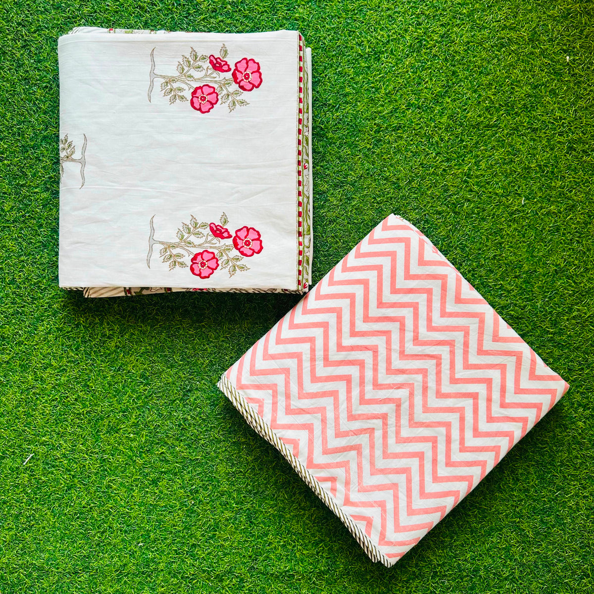 Pink-red floral spray reversible mulmul cotton dohar with a peach chevron reverse