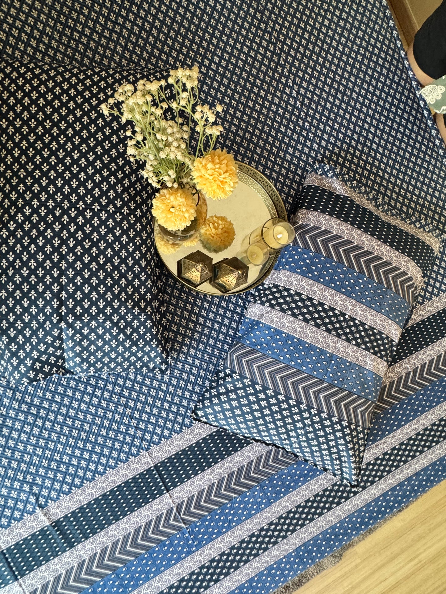 Close-up of the Preet Blue bedsheet showing the dotted navy print and chevron stripe border