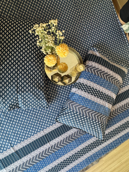 Close-up of the Preet Blue bedsheet showing the dotted navy print and chevron stripe border