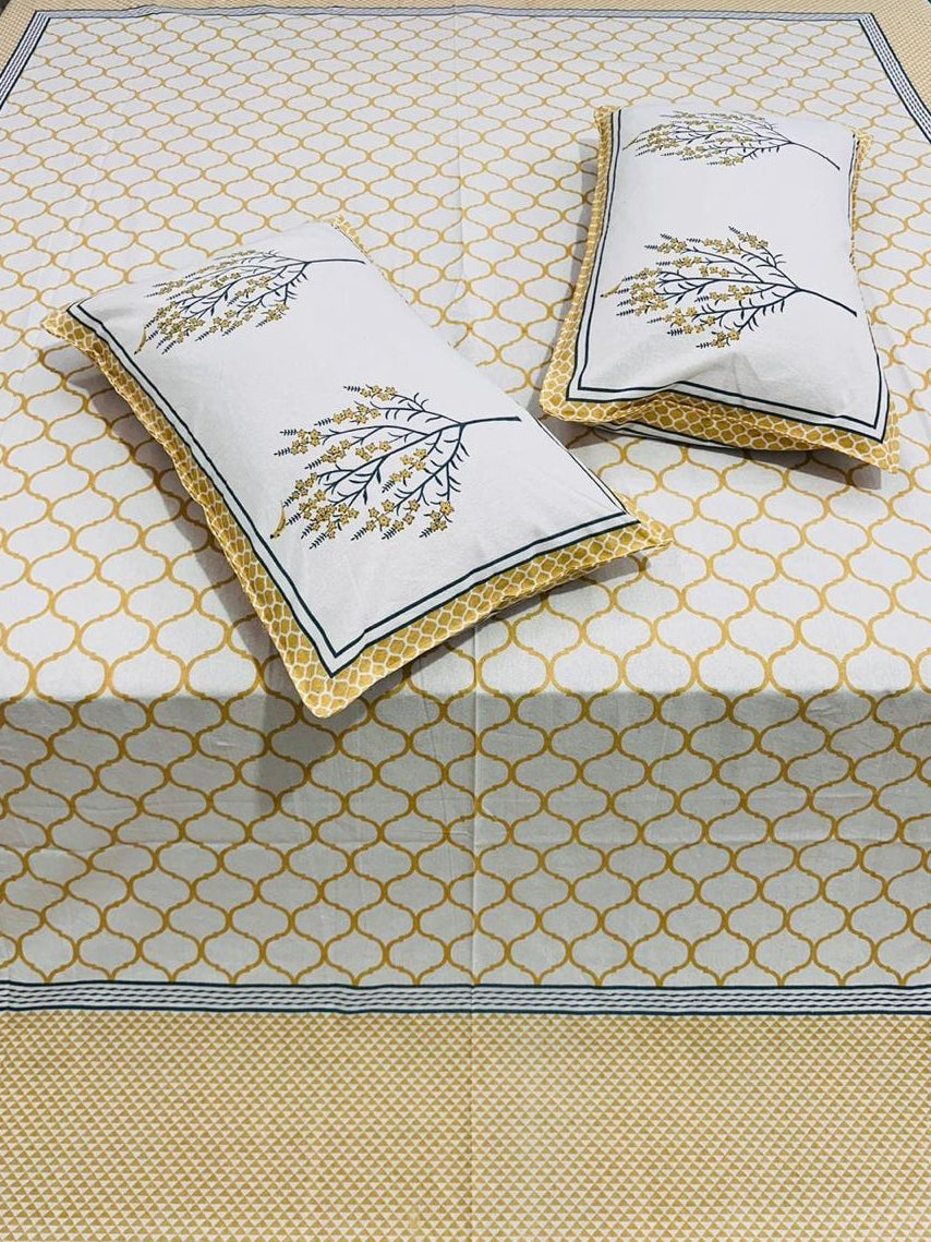 Set of decorative pillows with floral patterns on a textured surface