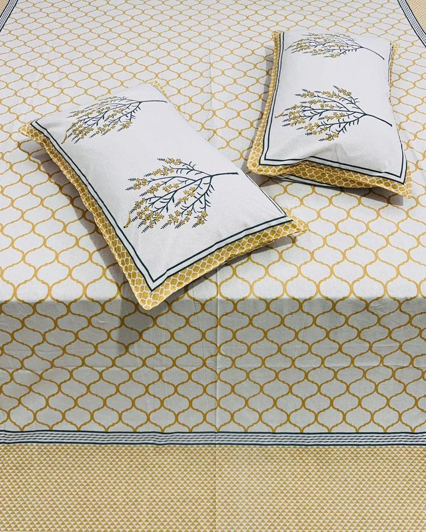 Set of decorative pillows with floral patterns on a textured surface