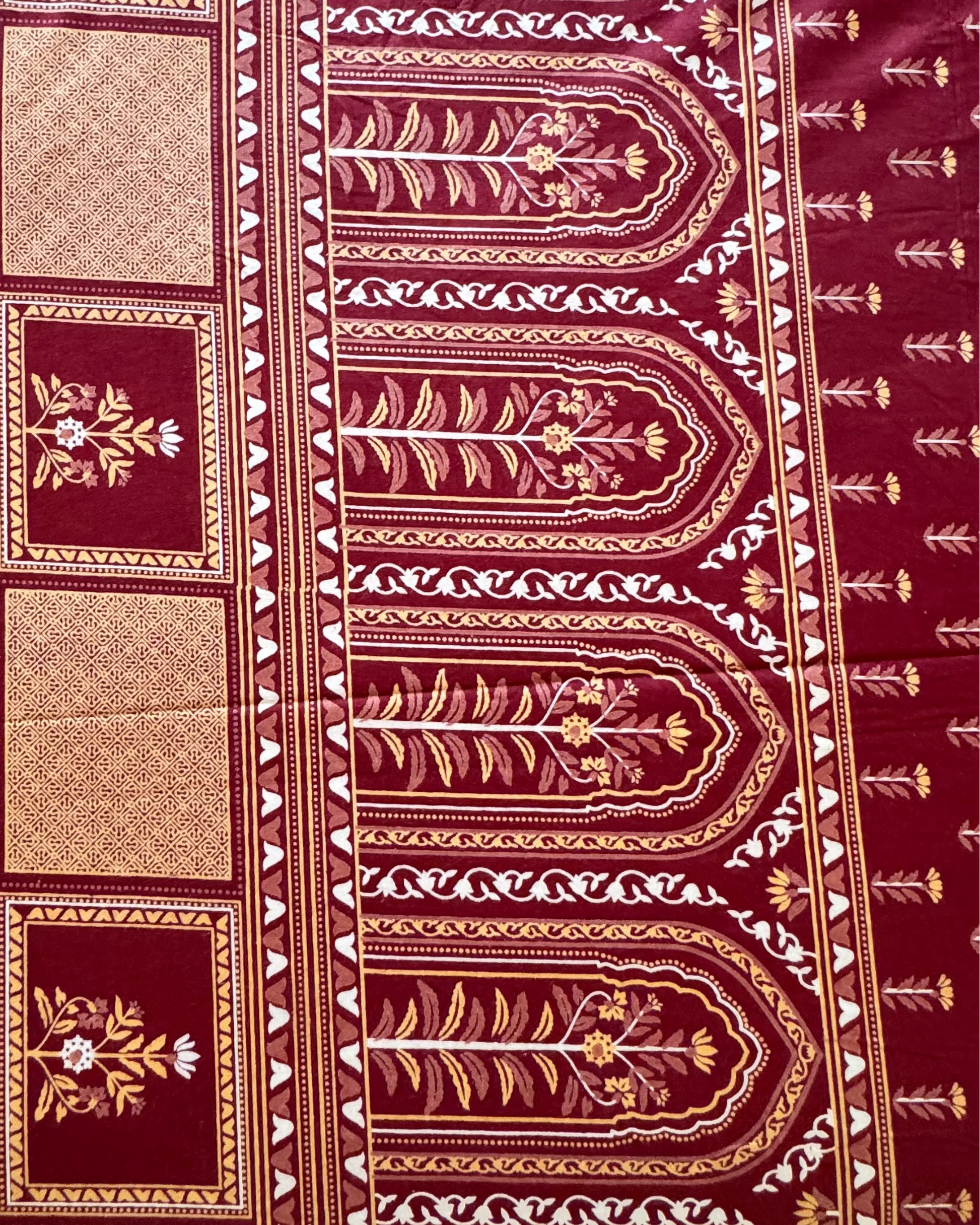 Close-up of the Tarang Red arched border print