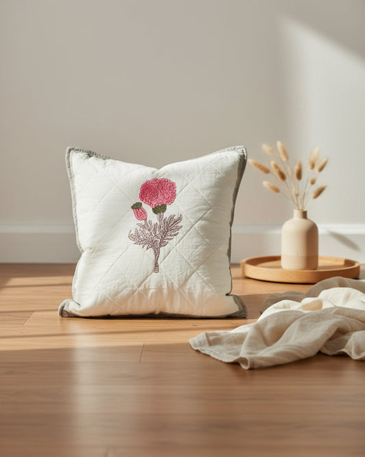 Kesariya grey quilted cushion cover styled with a pink flower motif