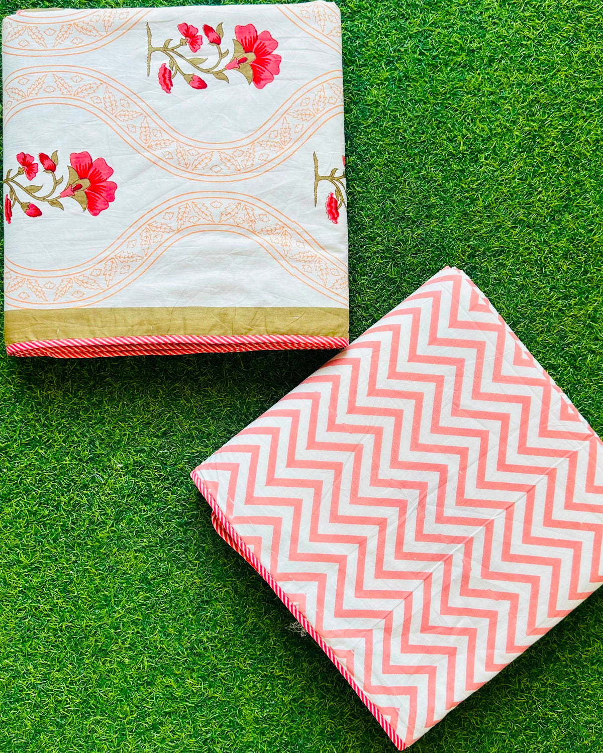 Wavy tan gold jaali stripe reversible mulmul cotton dohar with pink-red florals and a coral chevron reverse