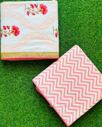 Wavy tan gold jaali stripe reversible mulmul cotton dohar with pink-red florals and a coral chevron reverse