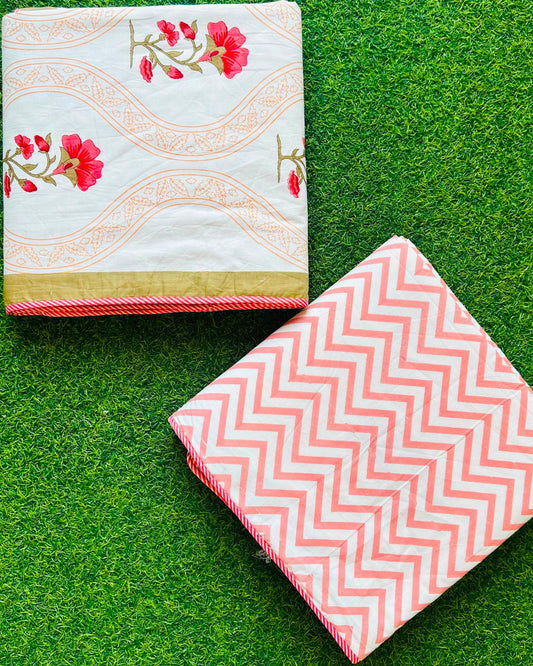 Wavy tan gold jaali stripe reversible mulmul cotton dohar with pink-red florals and a coral chevron reverse