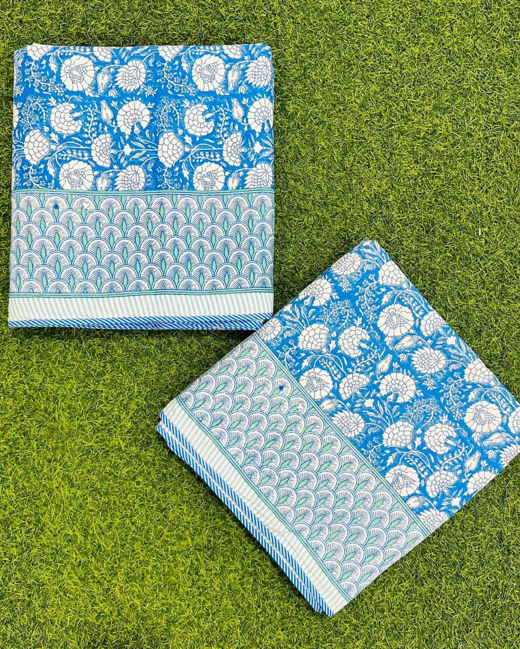 Bright blue floral reversible mulmul cotton dohar with a scalloped leaf border and striped edge