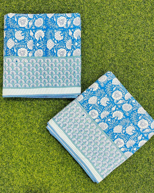 Bright blue floral reversible mulmul cotton dohar with a scalloped leaf border and striped edge