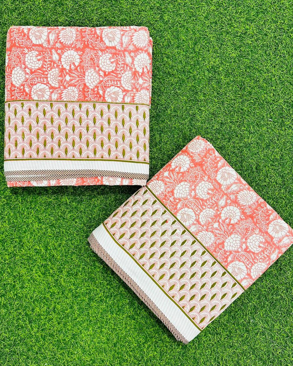 Coral pink floral reversible mulmul cotton dohar with a scalloped leaf border in pink and green