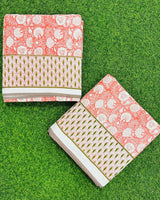 Coral pink floral reversible mulmul cotton dohar with a scalloped leaf border in pink and green