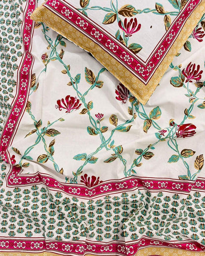 Single size red floral cotton bedsheet with crimson and mustard borders on ivory