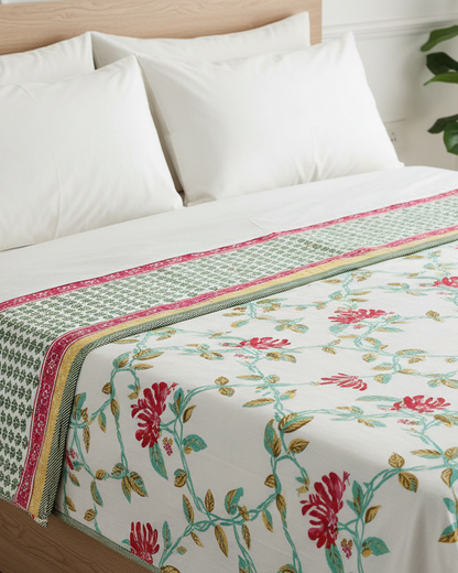Reversible red floral mulmul dohar with a green dotted border and mustard edge