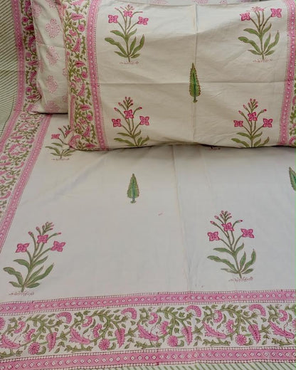 Malika hand block Percale Cotton bedsheet with pink flowers on green stems on ivory and a pink floral border