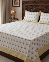Manjari yellow floral pure cotton bedsheet – styled on a bed