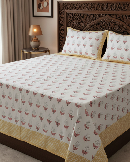 Manjari yellow floral pure cotton bedsheet – styled on a bed