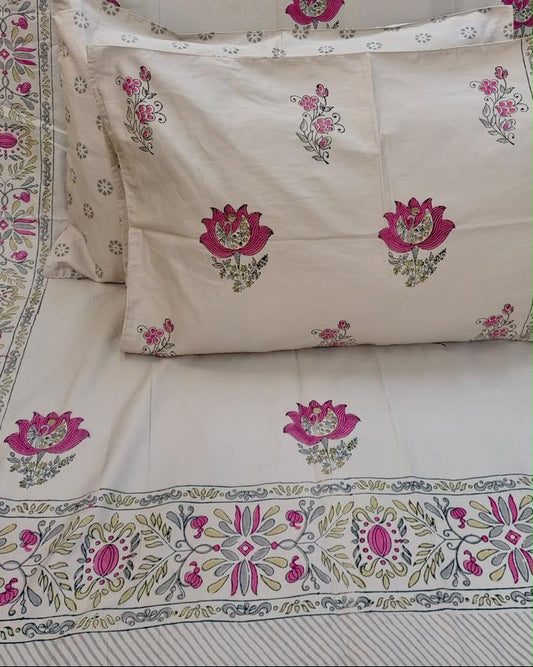 Nalini hand block Percale Cotton bedsheet with magenta lotus buta on ivory and a magenta and green border