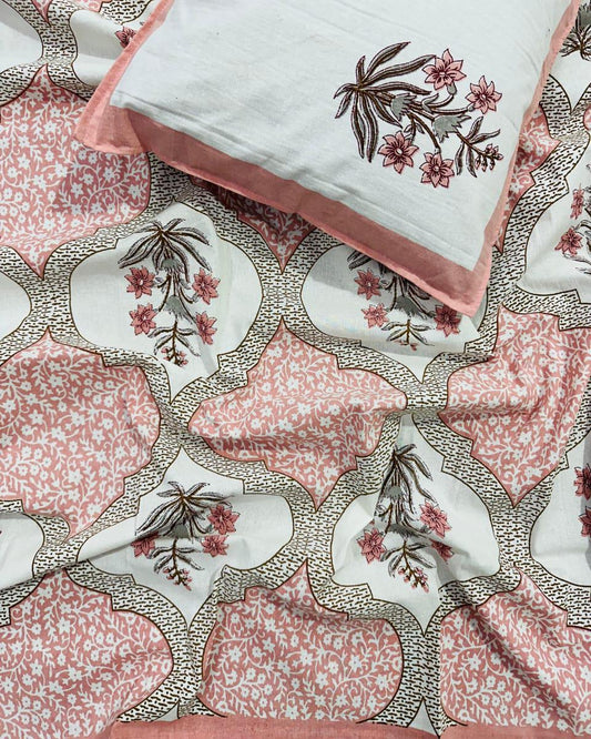 Single size blush pink Mughal ogee cotton bedsheet with a floral spray medallion
