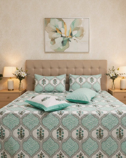 Pastel green Mughal ogee motif cotton bedsheet on white with a mint border