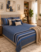 Preet Blue Everyday Cotton bedsheet with a dotted navy ground and blue and ivory stripe bands, with beige cushions