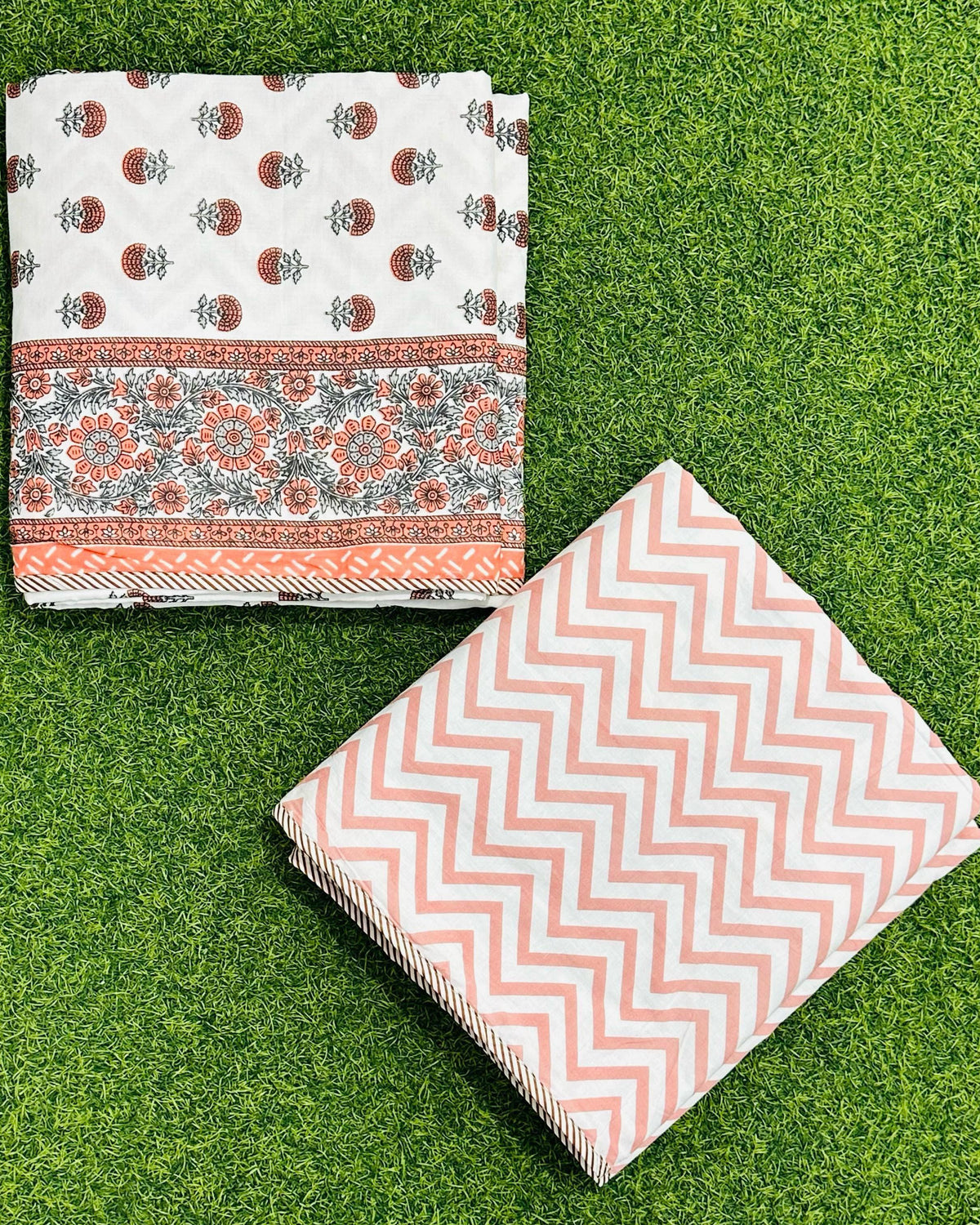 Orange floral cluster reversible mulmul cotton dohar with grey-green accents and an orange chevron reverse
