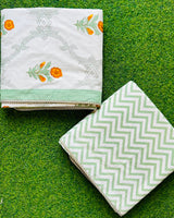 Sage medallion trellis reversible mulmul cotton dohar with marigold orange florets and a sage chevron reverse