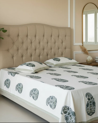 Sukoon green paisley pure cotton bedsheet – styled on a bed
