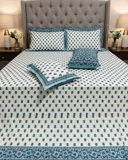 Teal blue floral booti cotton bedsheet on white with a blue border
