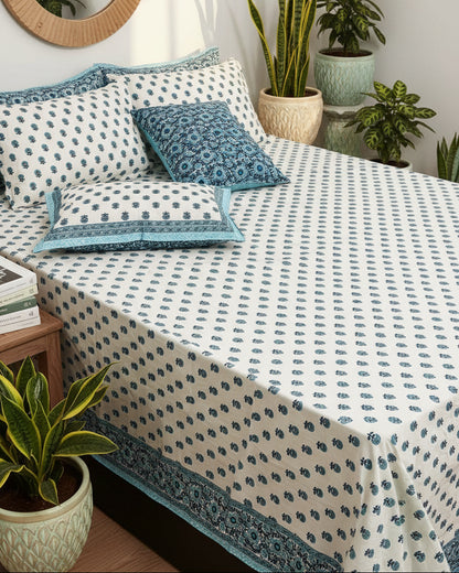 Sumedha blue floral pure cotton bedsheet – styled on a bed