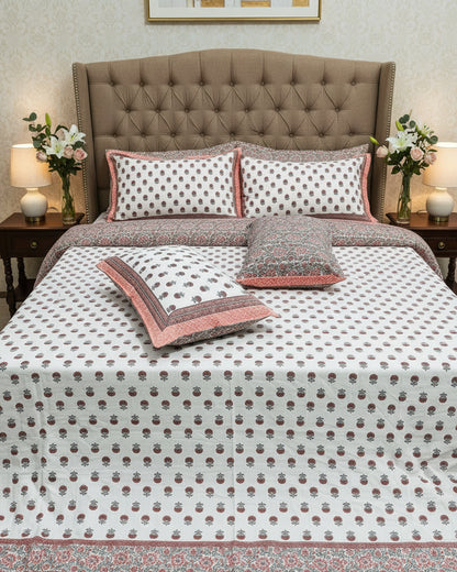 Coral orange floral booti cotton bedsheet on white with a coral border