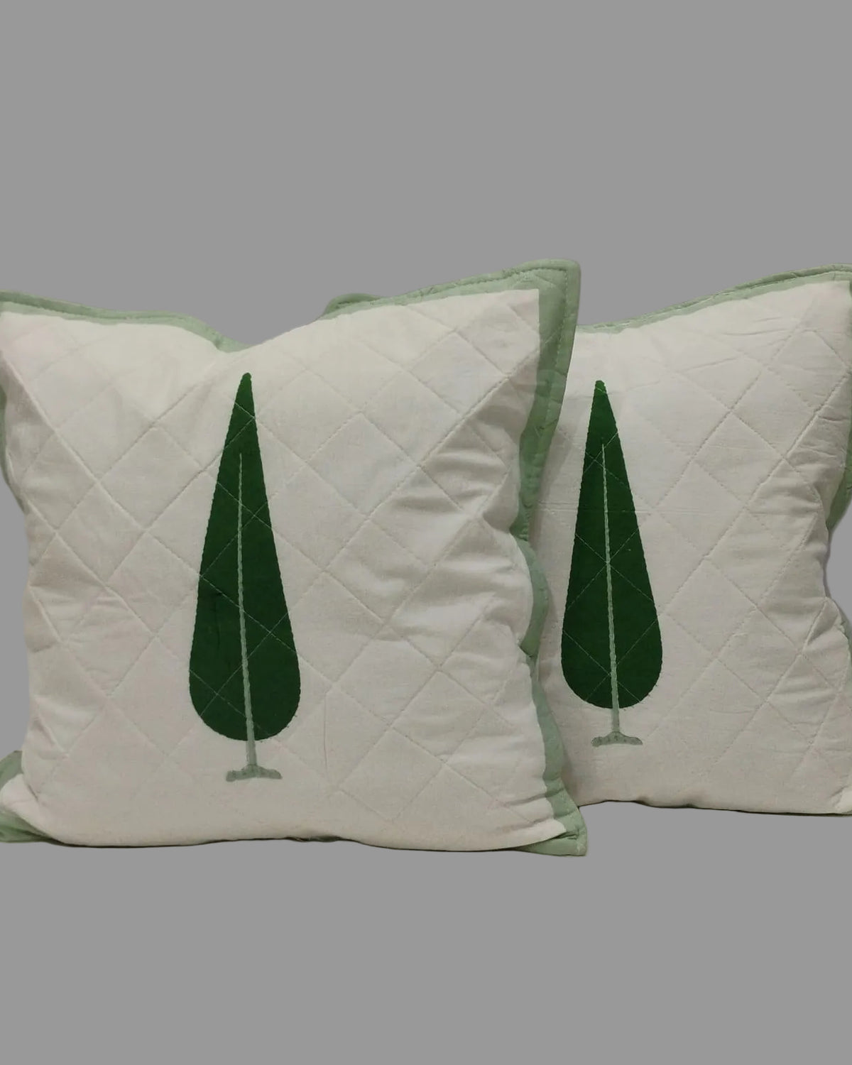 Pair of Suparna green quilted cushion covers with single cypress tree motifs