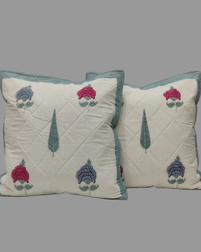 Pair of Tarangini blue quilted cushion covers with pink and blue flowers and teal tree motifs