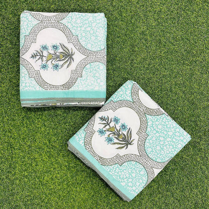Pair of Single pastel green Mughal ogee dohars folded on artificial grass