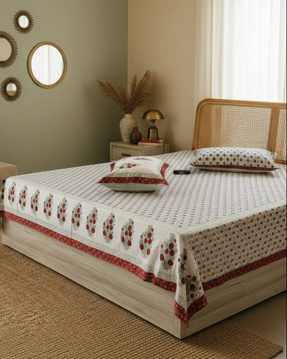 Zara red and sage cotton bedsheet styled in a sage green bedroom with round mirrors